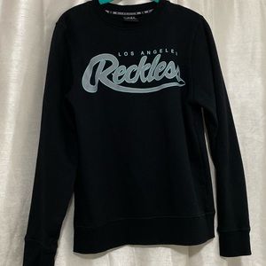 Young and reckless crew neck